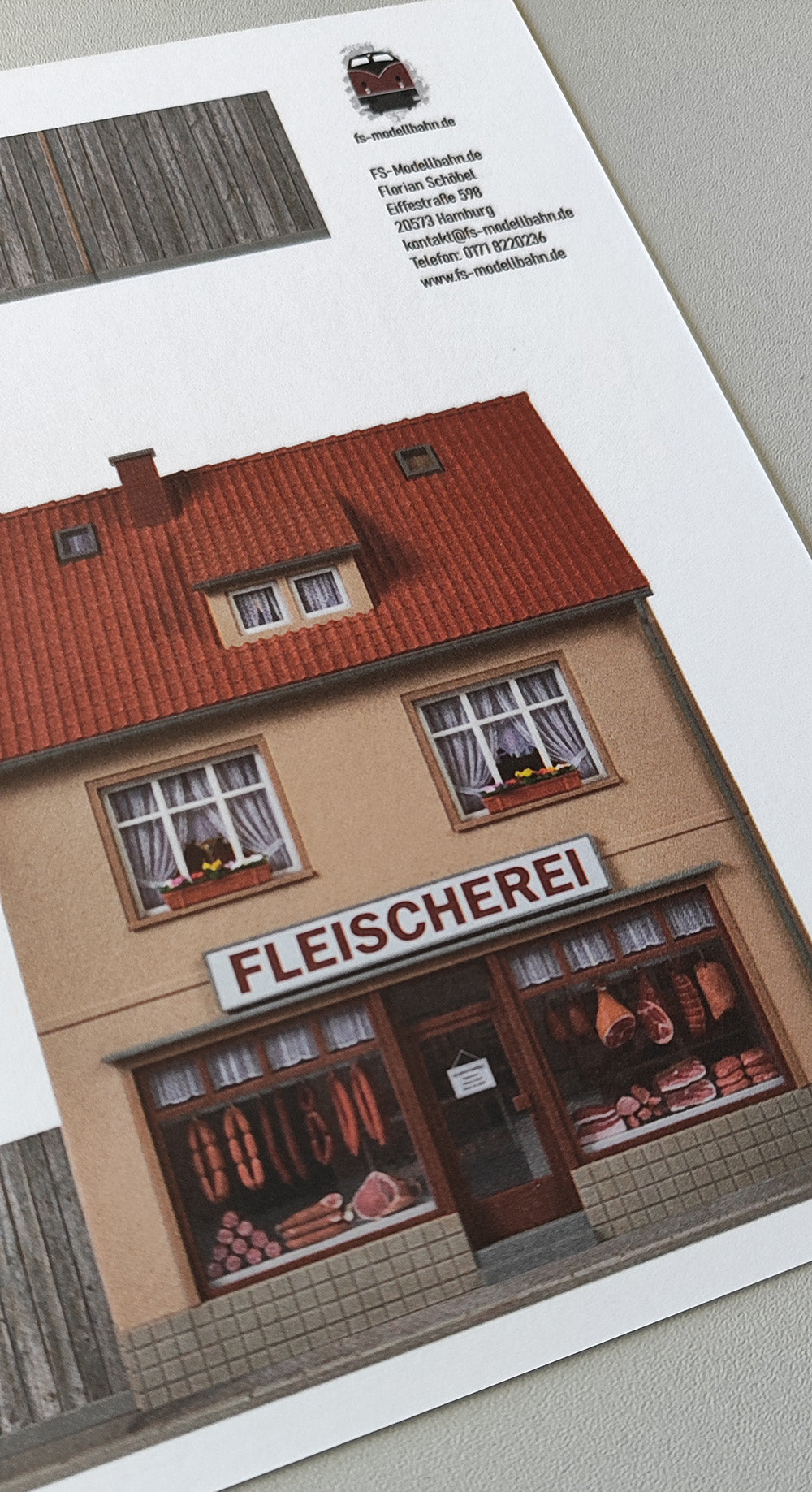 Model railway backdrop two-story facades with bakery Schmidt and butcher shop with wooden fence H0 scale 1:87